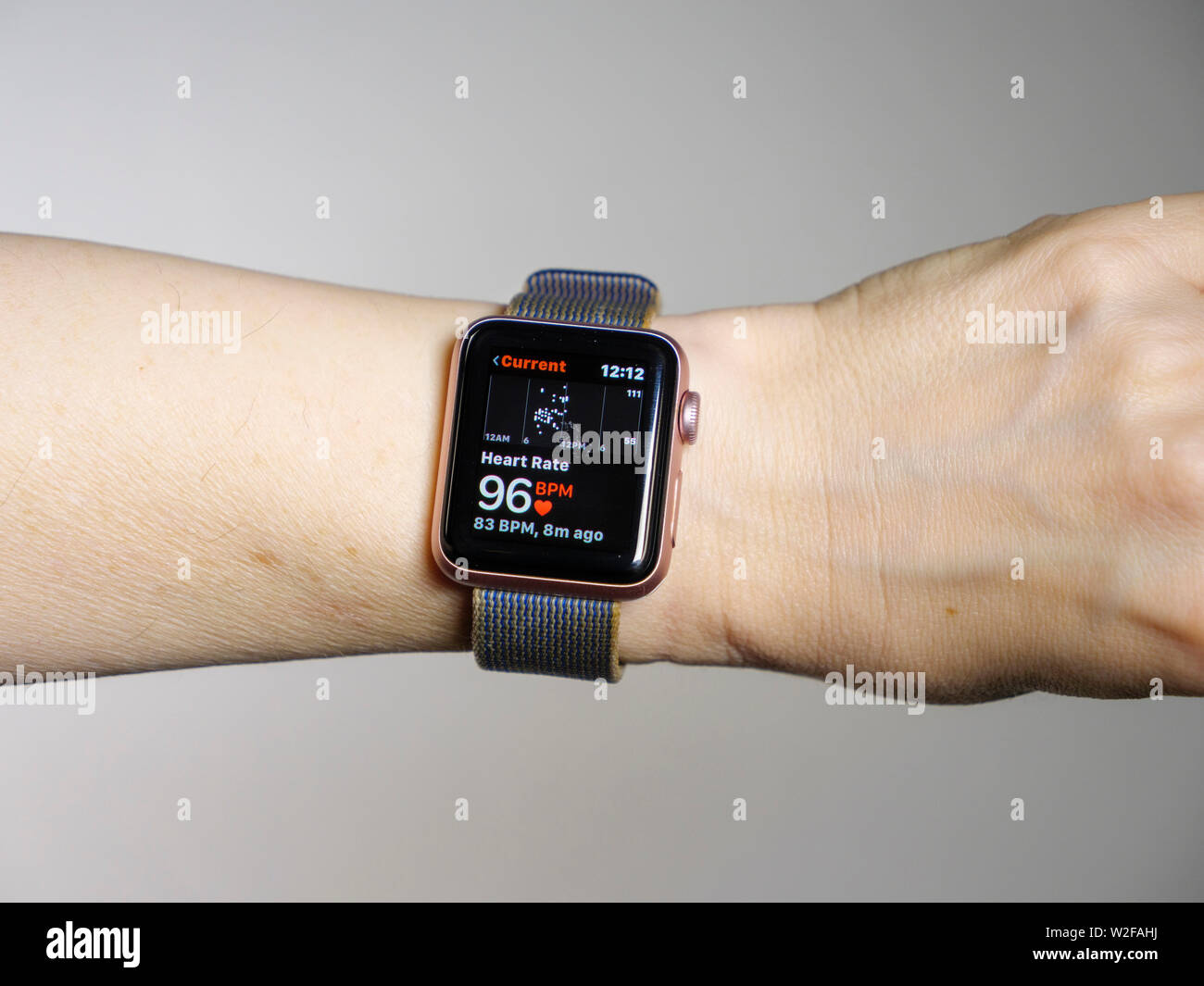 Apple Watch measuring heartbeat showing 96 beats per minute. Stock Photo
