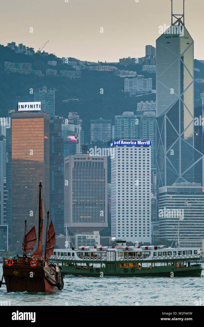 Tourist junk and skyline, Victoria harbour, Hong Kong, SAR, China Stock Photo