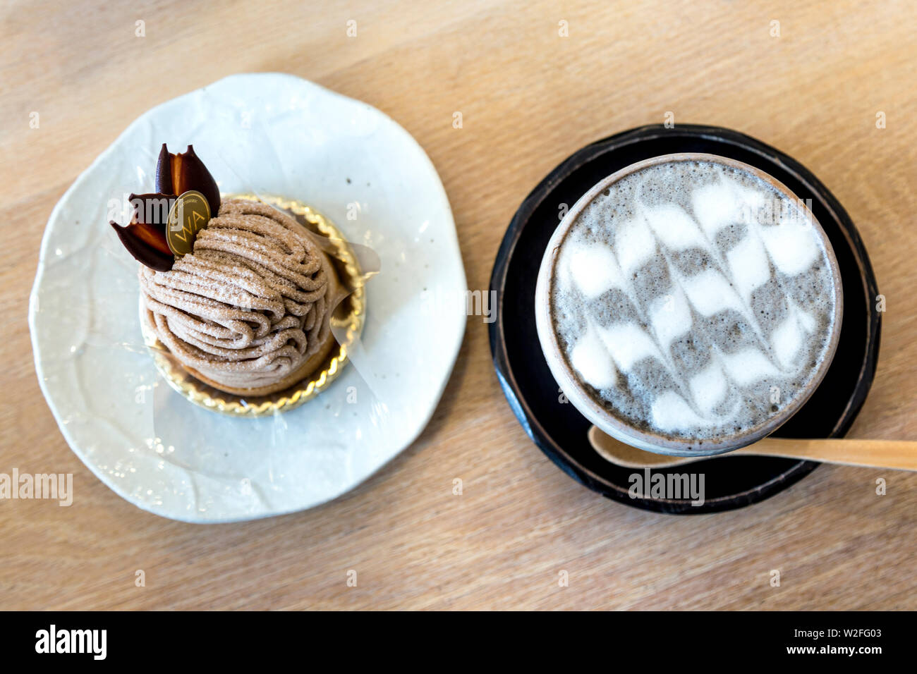 Chestnut cake and black sesame latte at Japanese WA Cafe and patisserie, Ealing Broadway, London, UK Stock Photo