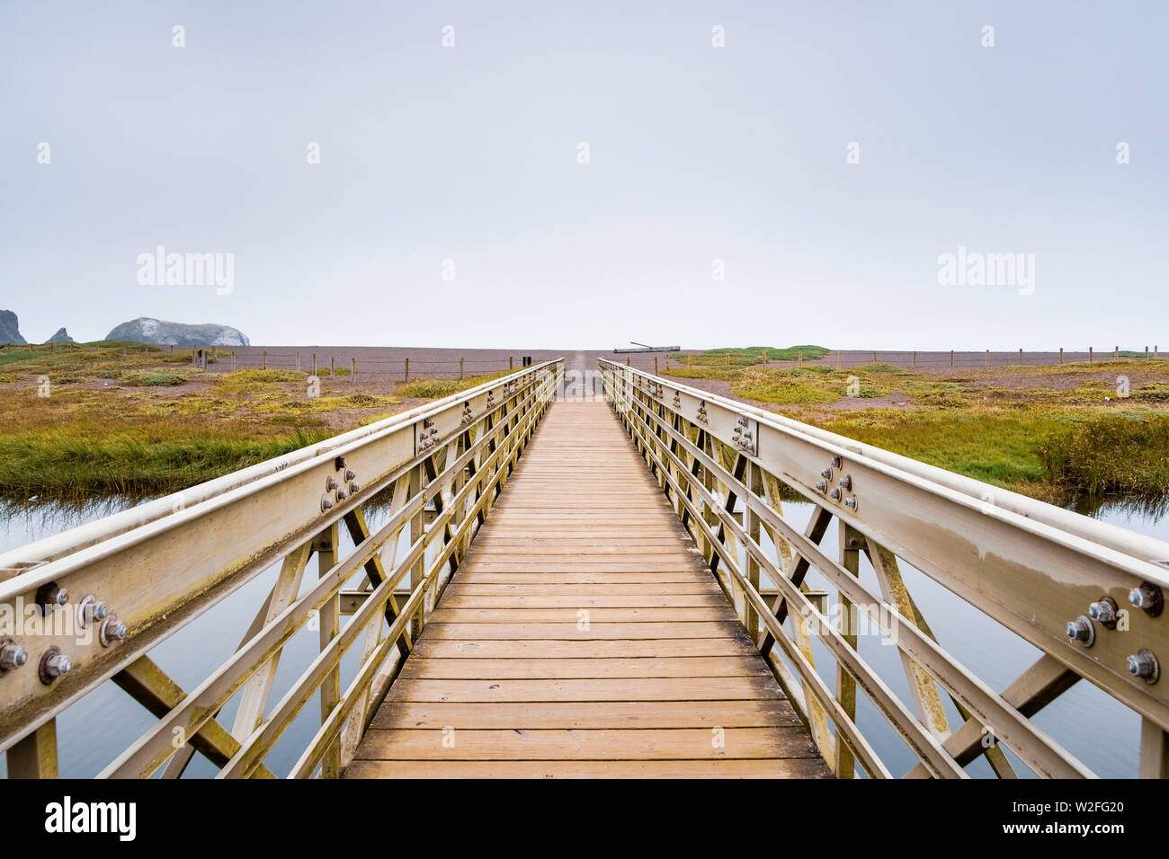 Wood and metal bridge crossing the Rodeo Lagoon towards Rodeo Beach, Marin Headlands, Golden