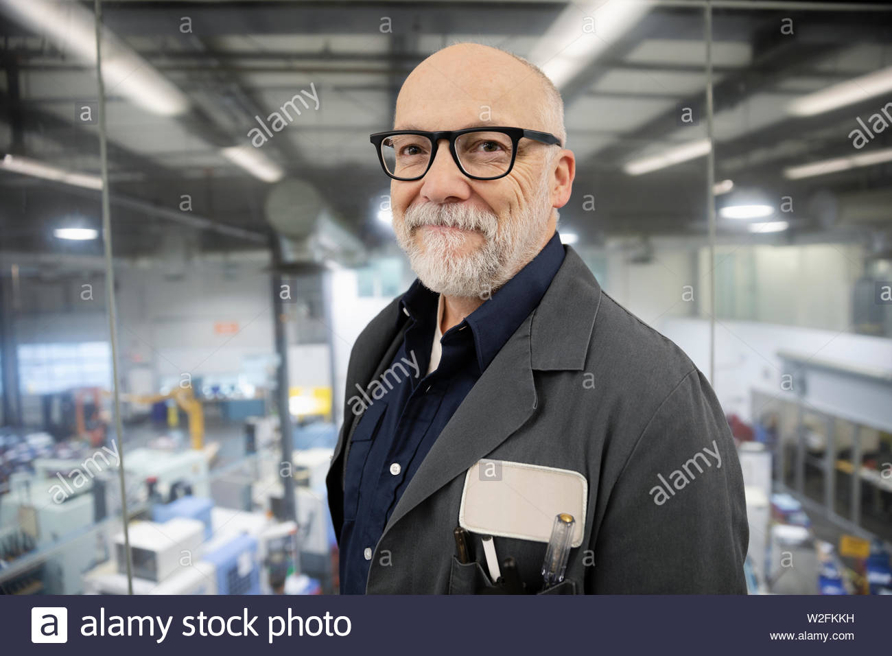 Portrait confident machine shop supervisor Stock Photo