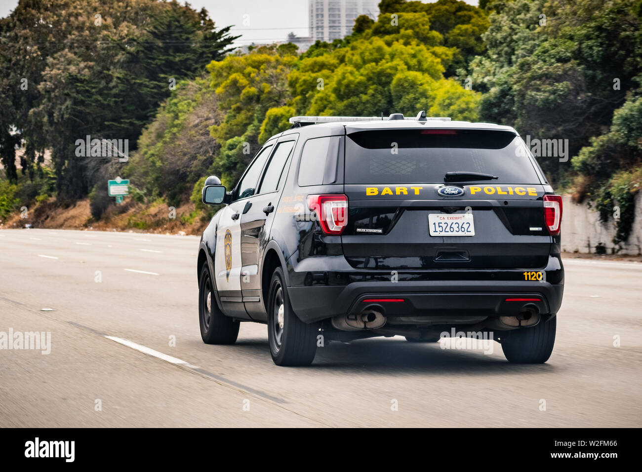 July 4, 2019 San Francisco / CA / USA - BART police vehicle driving on the freeway; BART police is the transit police agency of the BART rail system Stock Photo
