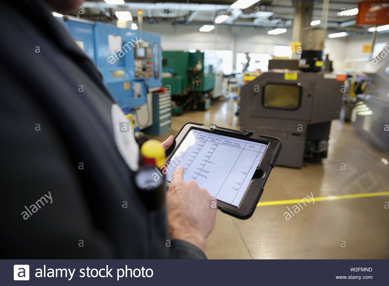 Male machinist using digital tablet in factory Stock Photo Alamy