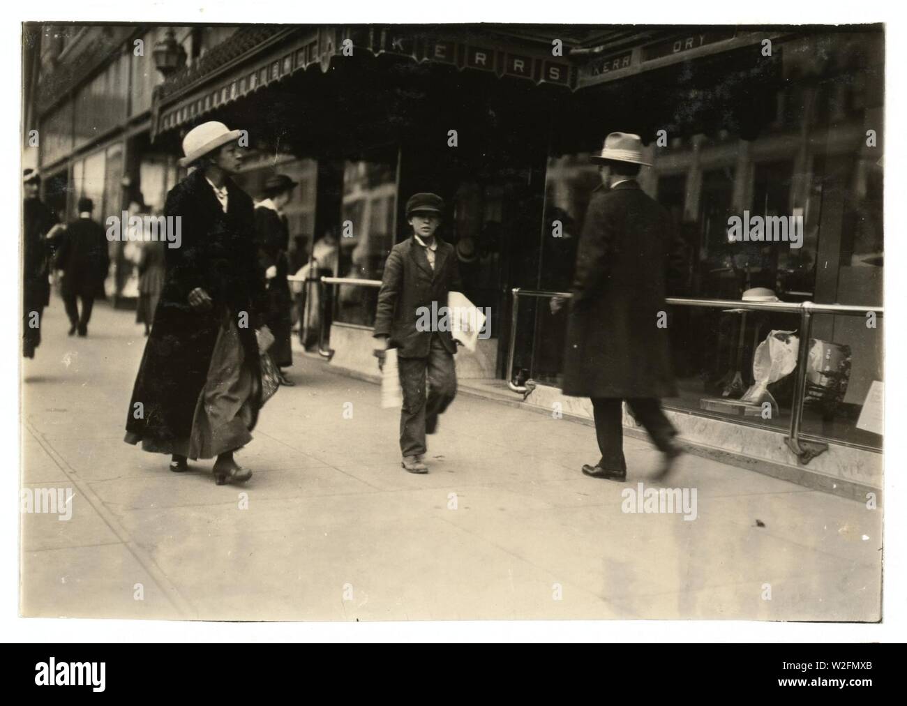 Charlie Scott, who lives at 19 Third St. is 9 years old and a truant newsboy. Said- 'I dunno where the school is.' Has been in the city 2 months. Photographed during school hours. Stock Photo
