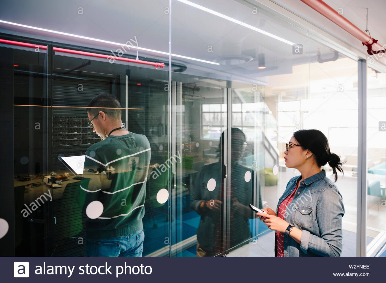 IT technicians in network server room Stock Photo