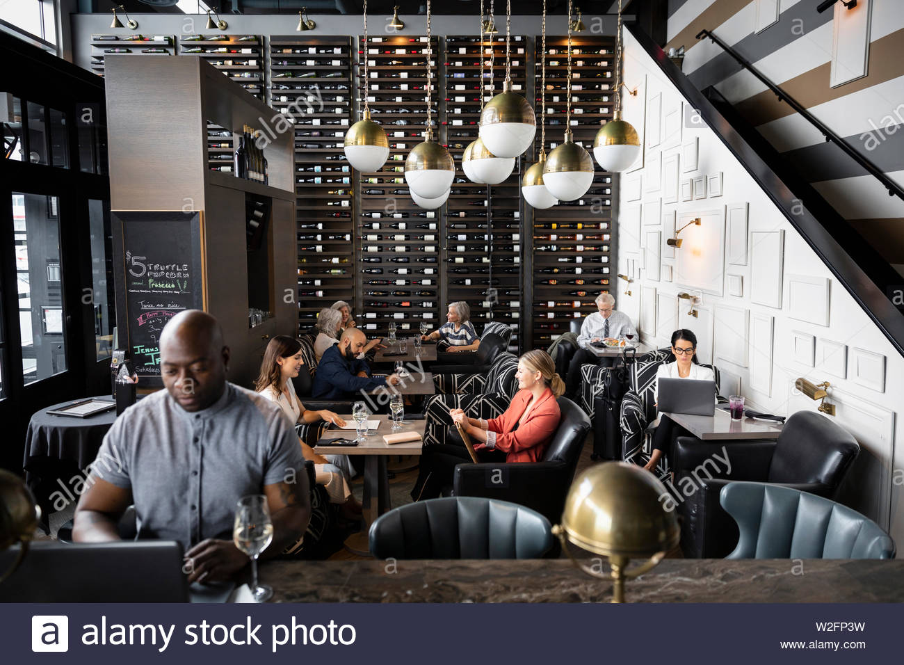 People working and drinking in wine bar Stock Photo Alamy