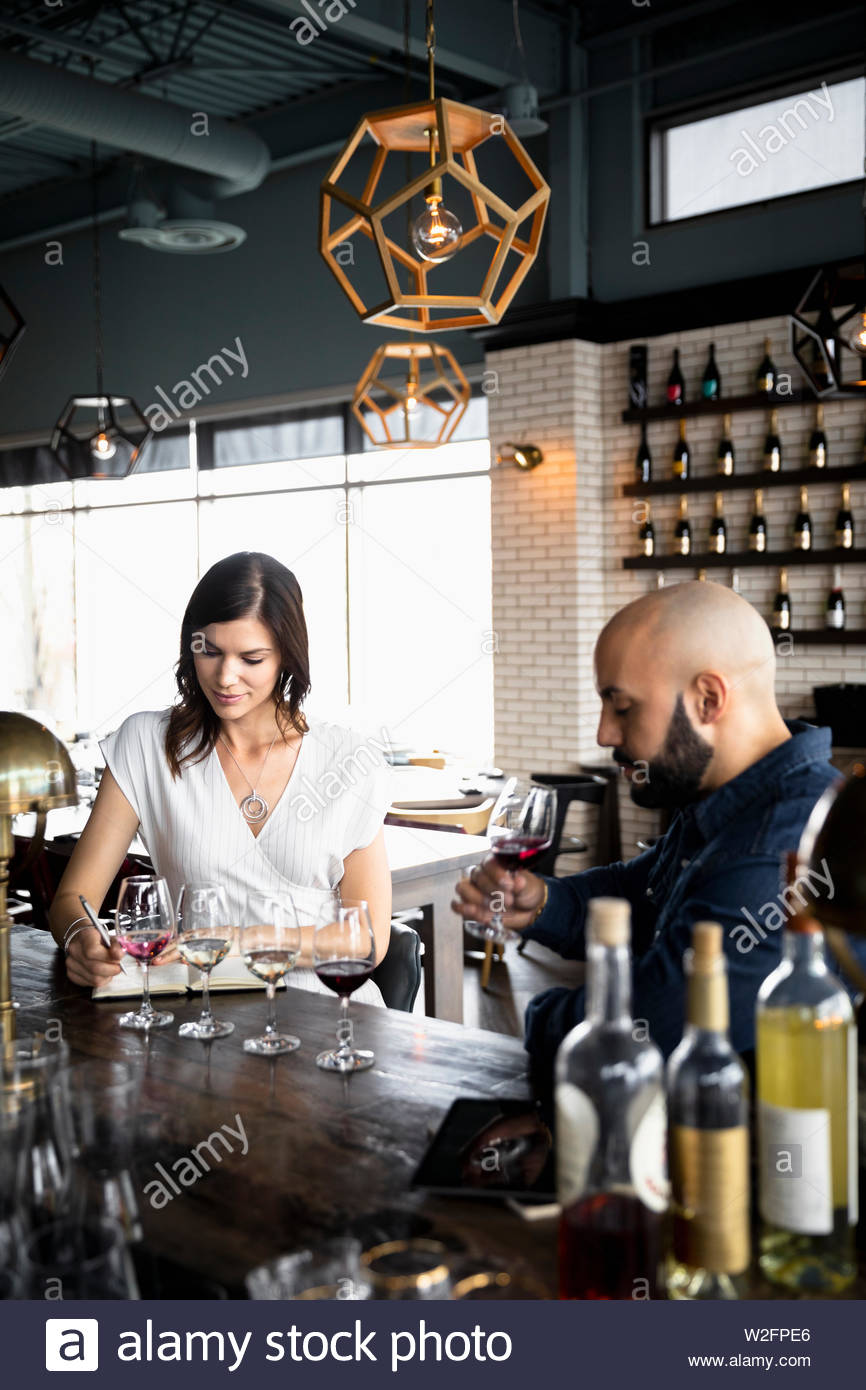Couple wine tasting in wine bar Stock Photo