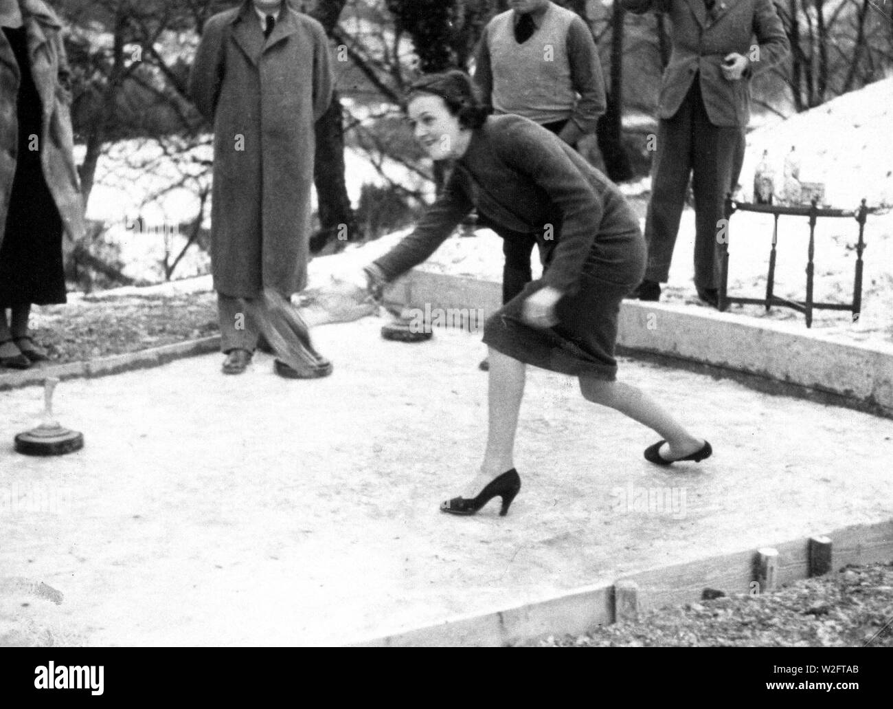 Eva Braun Collection (Album 2) - Woman playing some type of curling game outdoors ca. 1930s Stock Photo