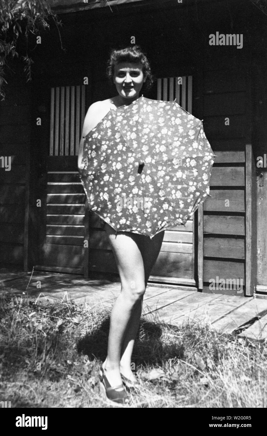 Eva Braun Collection (devet) - Eva Braun wearing only an umbrella ca. late 1920s ? Stock Photo