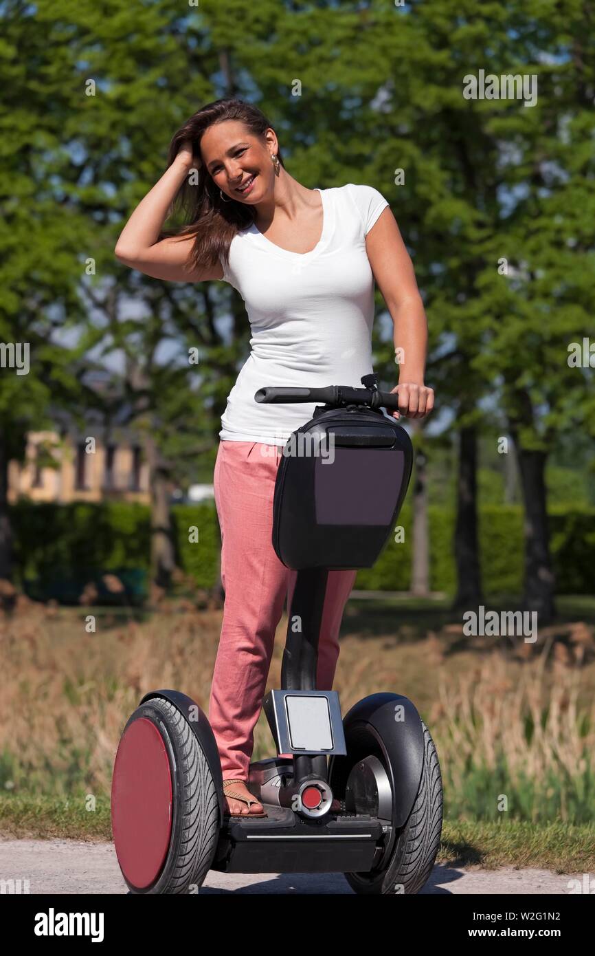 Young woman segway hi res stock photography and images Alamy