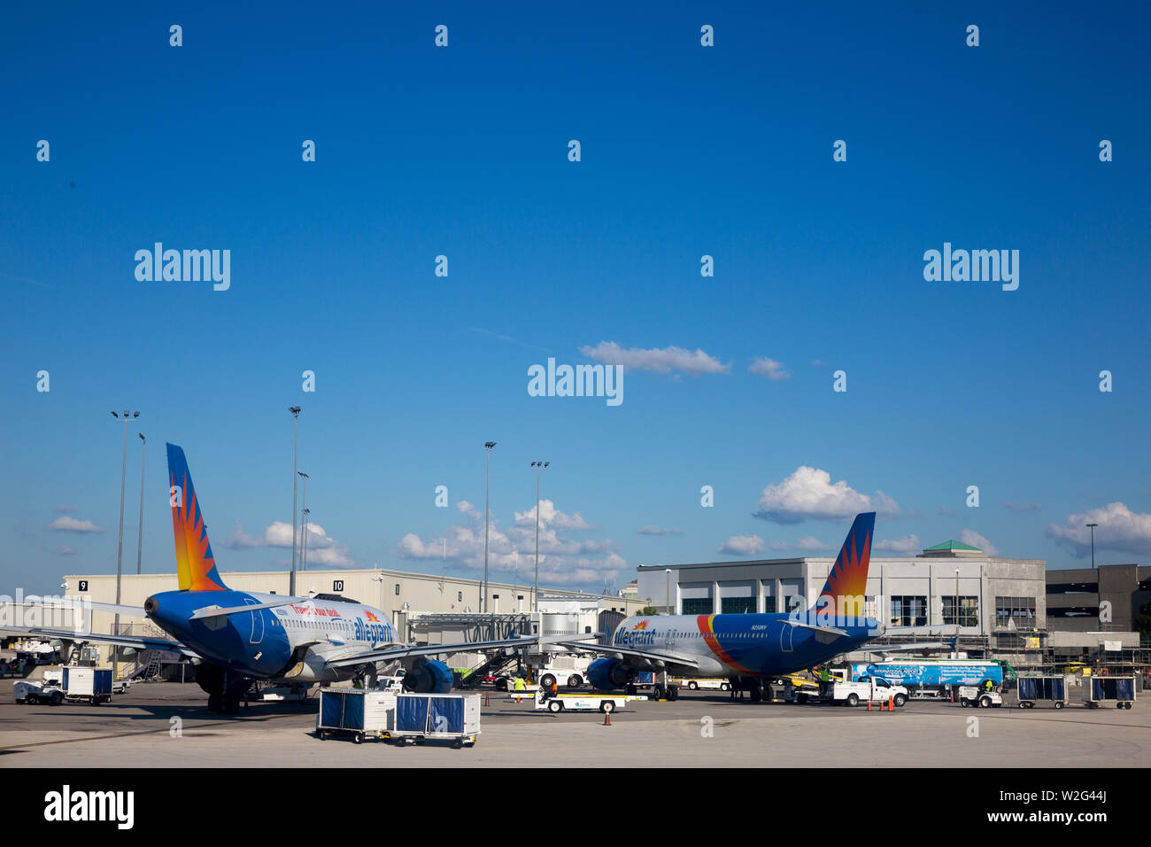 Two of Allegiant Air's fleet of Airbus A320 jet airliners are parked at the Orlando Sanford International Airport terminal in Sanford, Florida, USA. Stock Photo