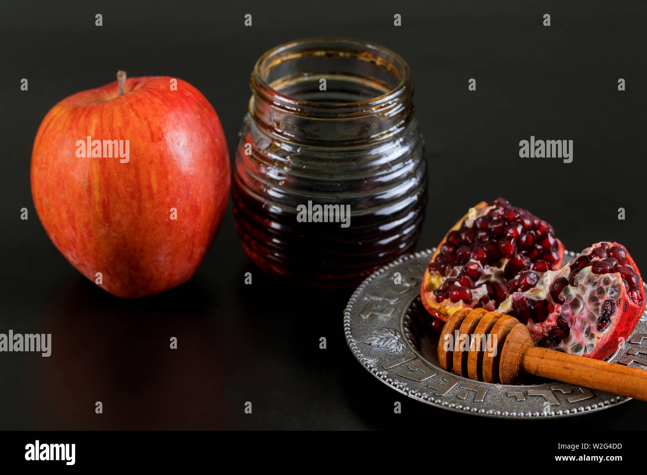 Apples, pomegranate and honey for Rosh Hashanah jewish holiday Stock Photo