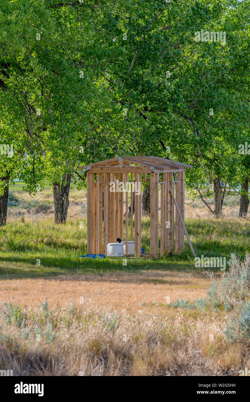 Open air outhouse with toilet in Saskatchewan, Canada outhouse under