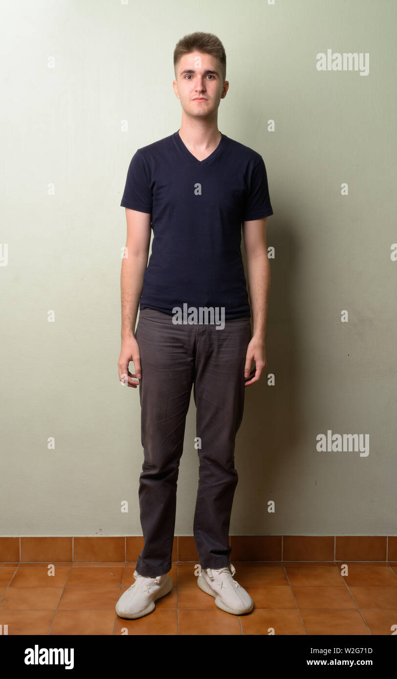 Full body shot of young handsome man Stock Photo - Alamy