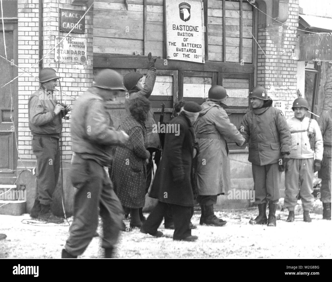 Original caption: Generals of the 101st Airborne Division review the 101st Div. in the town of Bastogne, Belgium. They are in front of "The Bastion of the Battered Bastards of the 101st." Original caption: Generals of the 101st Airborne Division review the 101st Div. in the town of Bastogne, Belgium. They are in front of "The Bastion of the Battered Bastards of the 101st."