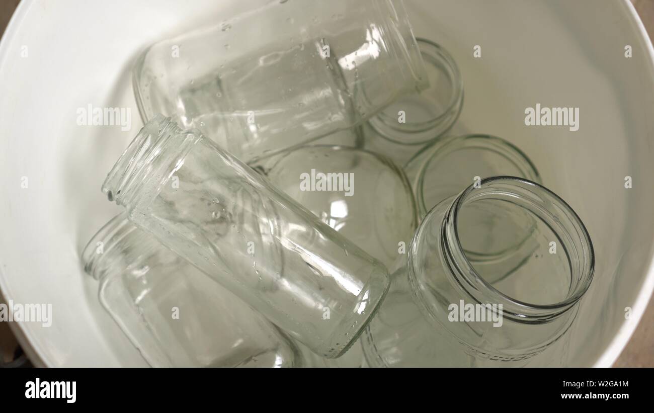 Waste sorting and recycling. Glass jars in recycle bin. Separate