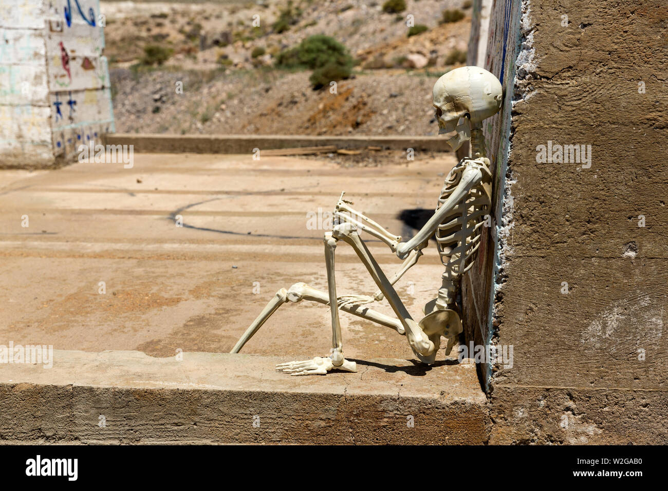 Skeleton hanging out at Ludwig mine Nevada ruins Stock Photo - Alamy
