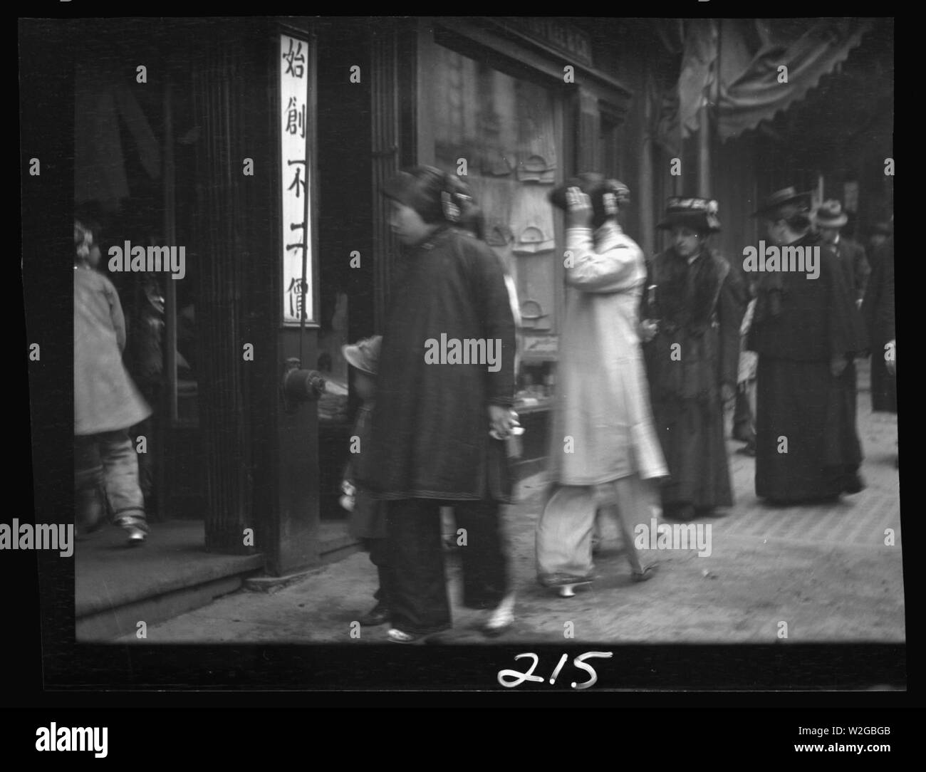 Chinese and American women walking down a street, Chinatown, San Francisco Stock Photo
