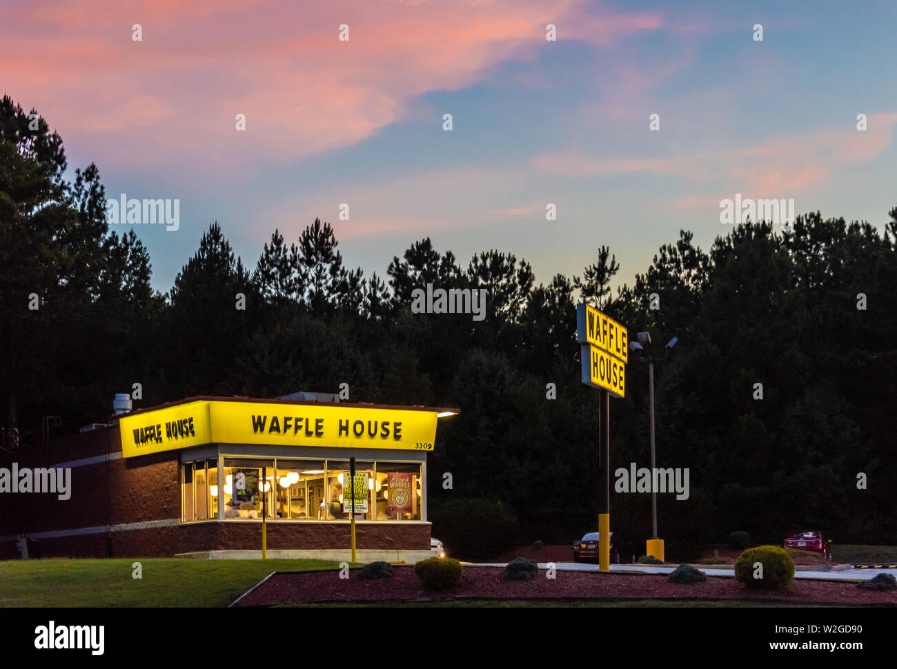 Waffle House 24/7/365 restaurant at sunset in Snellville, Georgia. (USA) Stock Photo