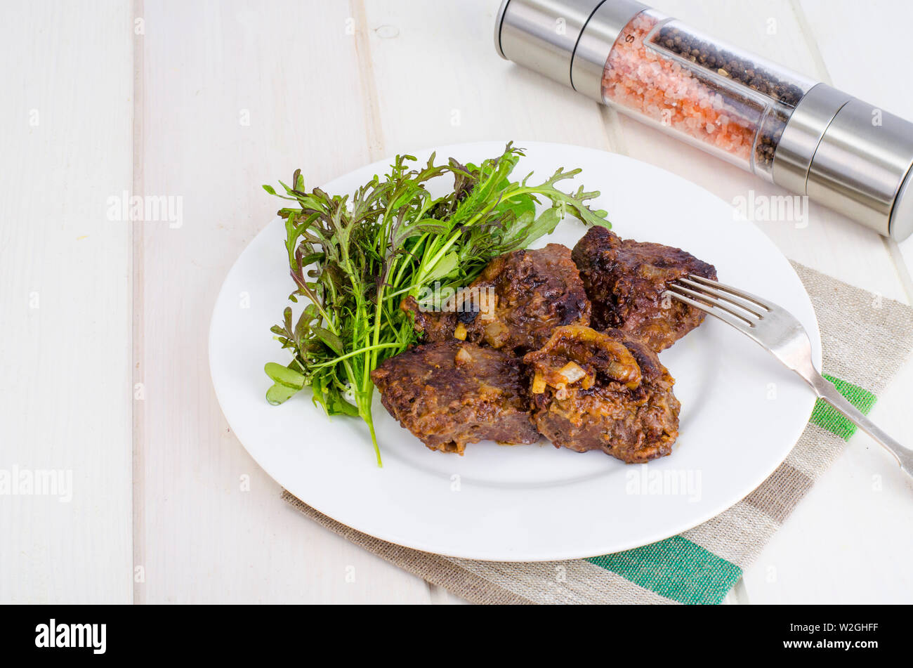 Fried beef liver with lettuce mix Stock Photo Alamy