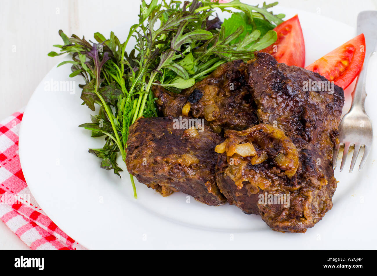Fried beef liver with lettuce mix Stock Photo Alamy