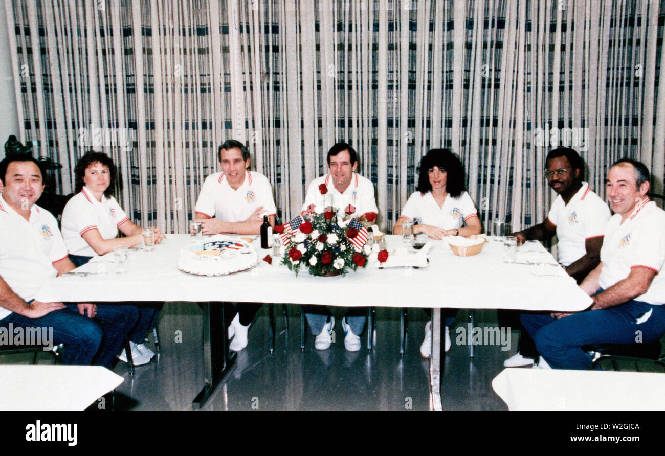 (28 Jan. 1986) --- Crew members of the STS-51L mission are seated for breakfast launch morning in the Operations and Checkout Building prior to liftoff of the space shuttle Challenger scheduled for 9:38 a.m. Stock Photo