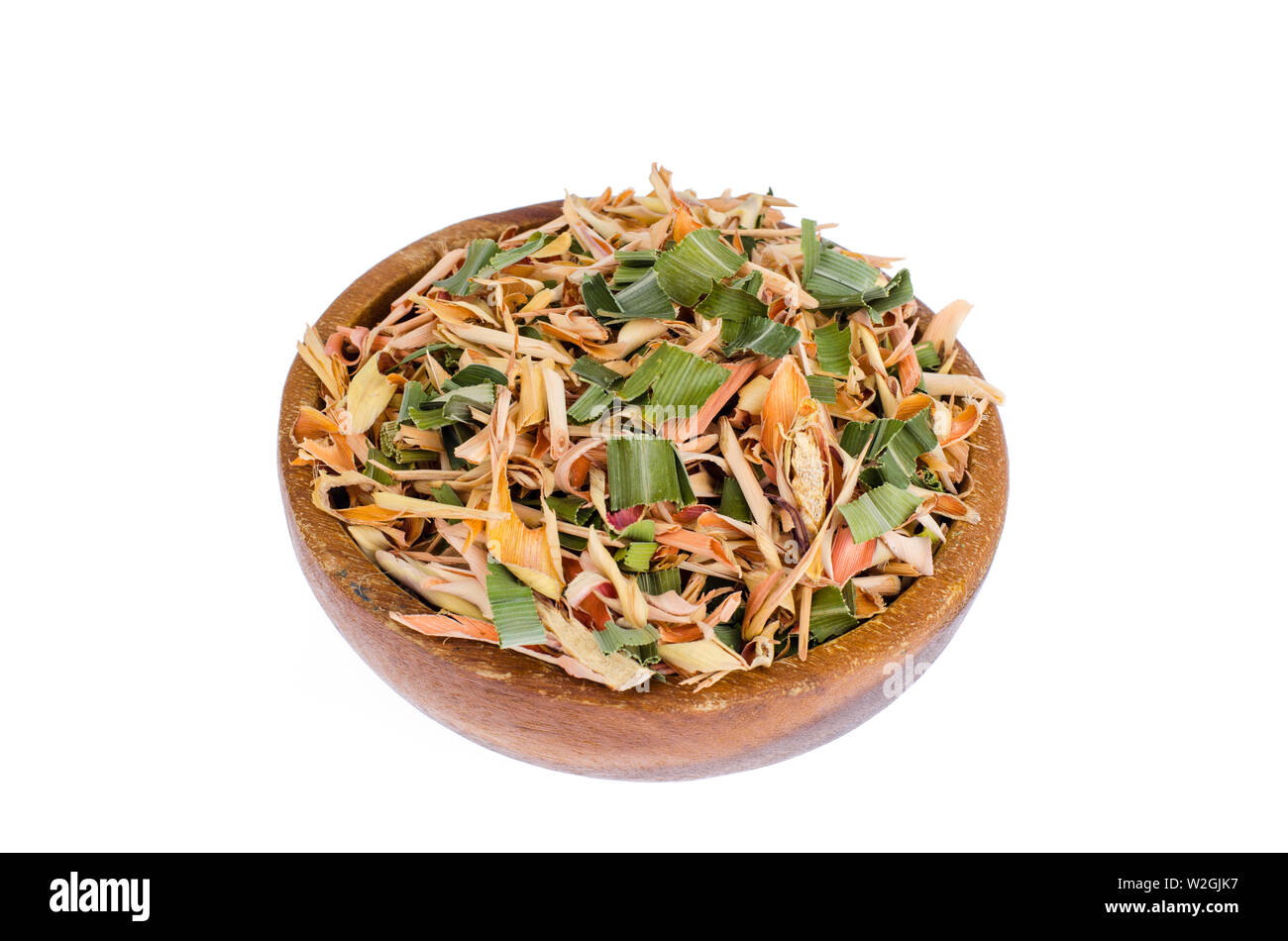 Dried lemongrass leaves in wooden bowl.  Stock Photo