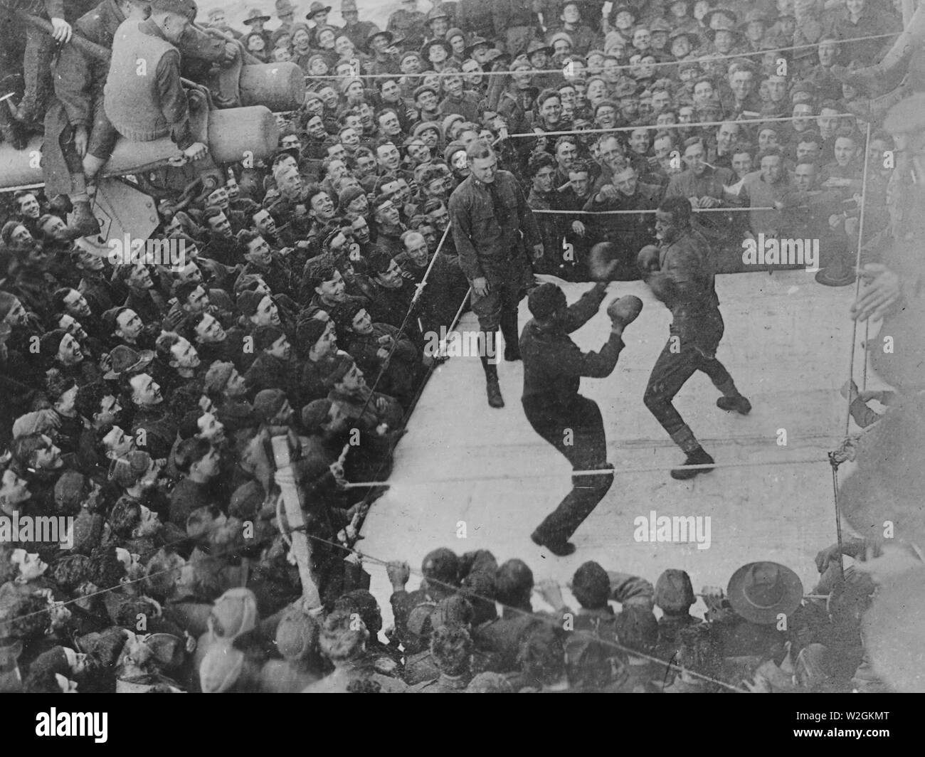 Troops on board a transport being entertained by a boxing match between two negro soldiers ca. 1917-1918 Stock Photo