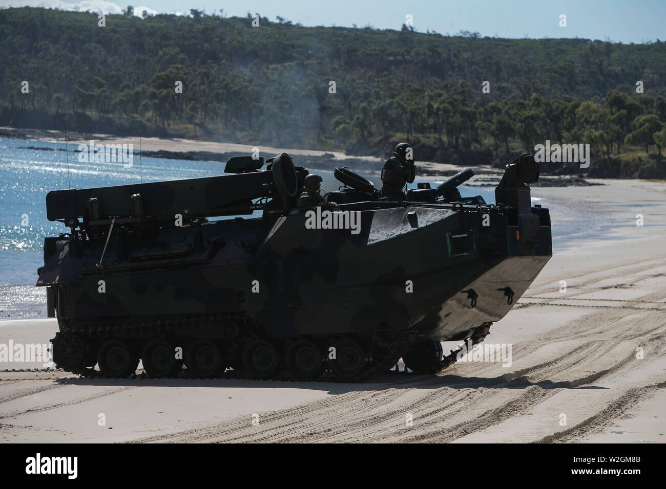 An Assault Amphibious Vehicle, recovery variant, with Combat Logistics Battalion 31, 31st Marine Expeditionary Unit, lands on the Coast of Townshend Island, Queensland Australia, July 1, 2019. The 31st MEU, the Marine Corps’ only continuously forward-deployed MEU, provides a flexible and lethal force ready to perform a wide range of military operations as the premier crisis response force in the Indo-Pacific region. (U.S. Marine Corps photo by Lance Cpl. Kyle P. Bunyi) Stock Photo