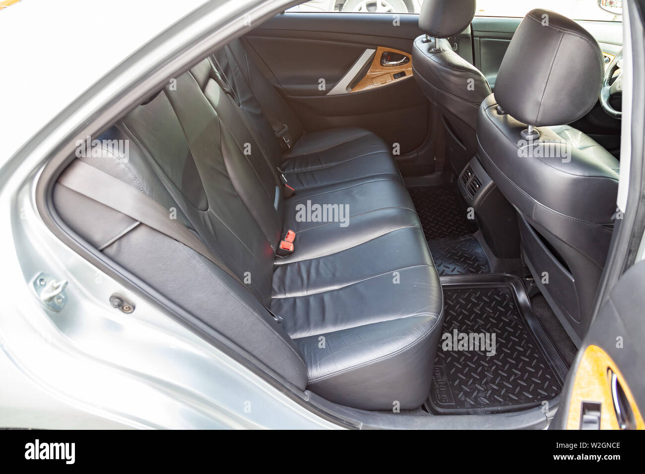 Novosibirsk, Russia - 07.09.2019: View to the interior of Toyota Camry 2006 with dashboard, rear seats, black leather after cleaning before sale on pa Stock Photo