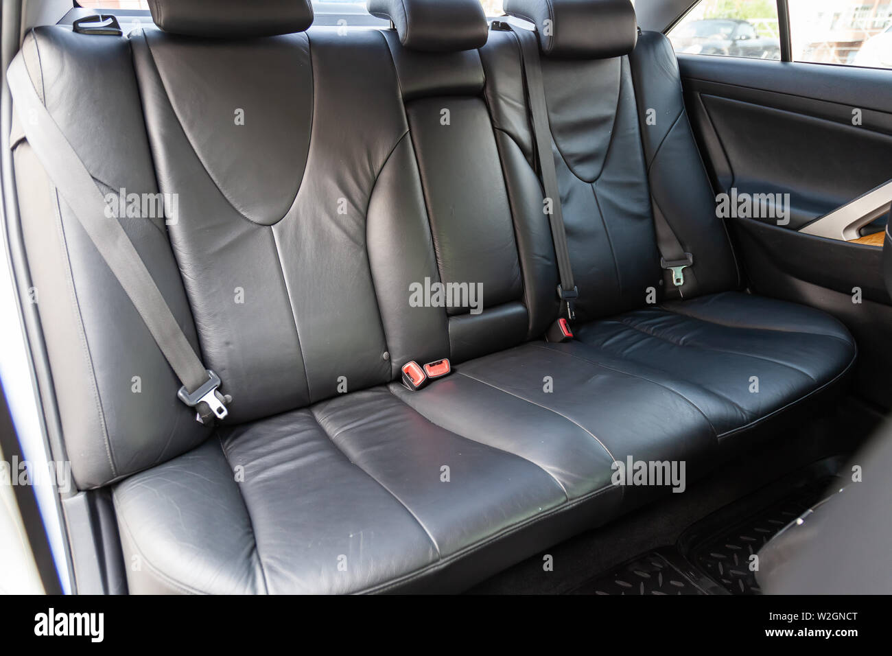 Novosibirsk, Russia - 07.09.2019: View to the interior of Toyota Camry 2006 with dashboard, rear seats, black leather after cleaning before sale on pa Stock Photo