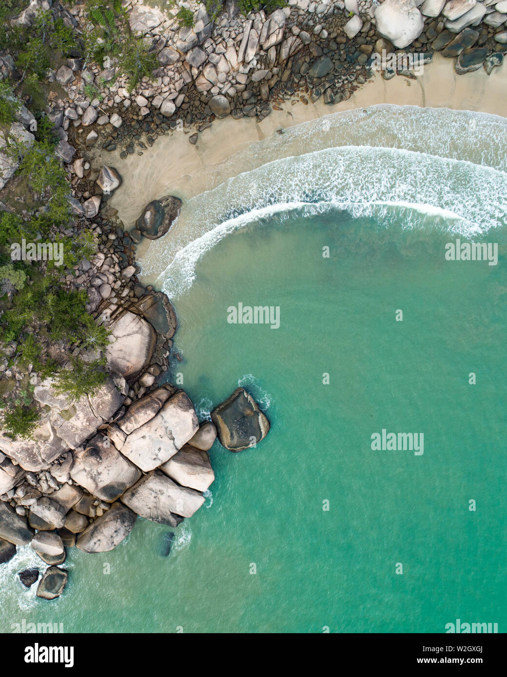 Aerial views over a tropical island in a middle of an archipelago. Drone shots over Magnetic island in north queensland and near the great barrier ree Stock Photo