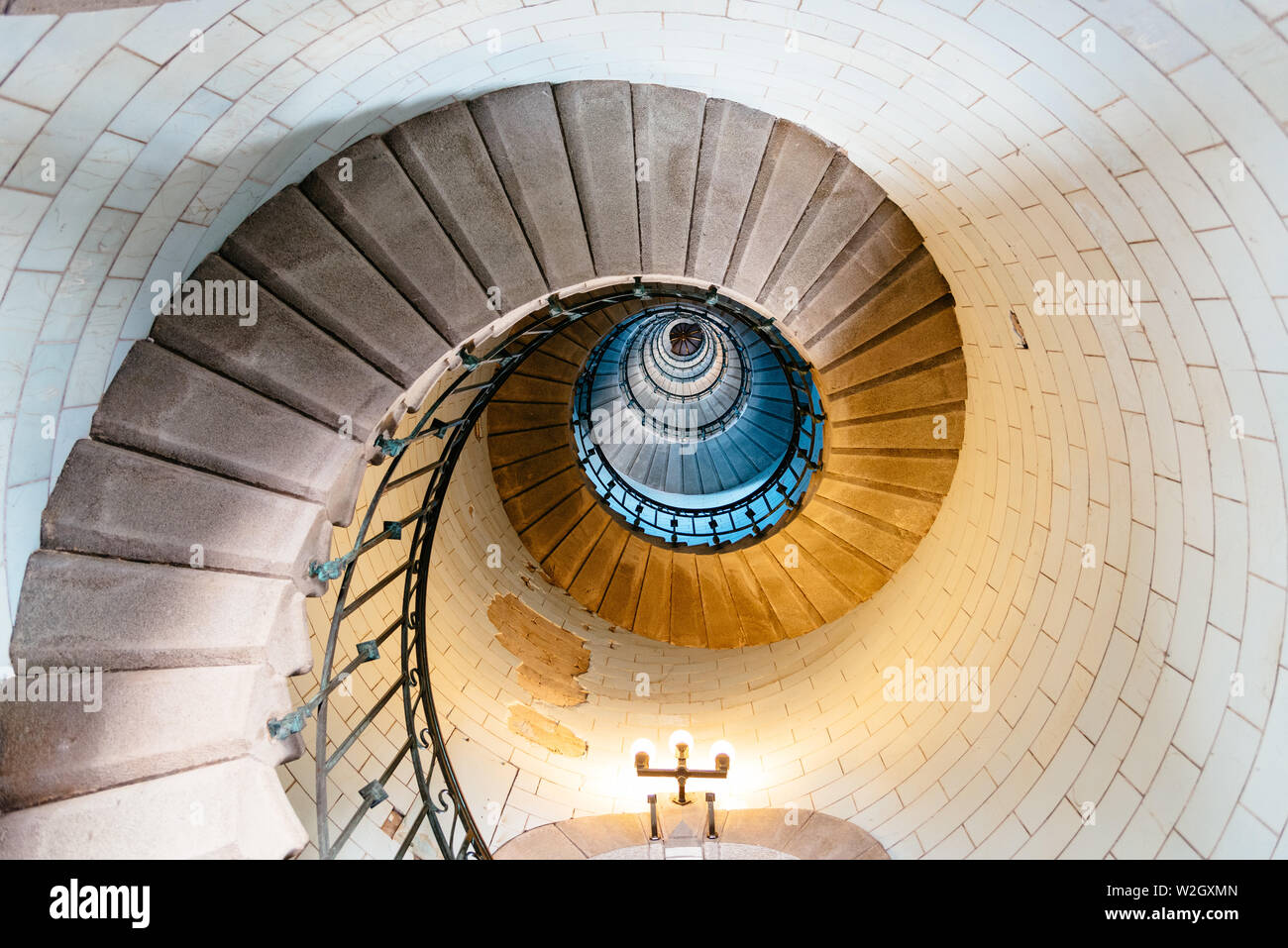 Penmarch, France - August 2, 2018: Spiral staircase in Eckmuhl Lighthouse in Brittany. Directly below view Stock Photo