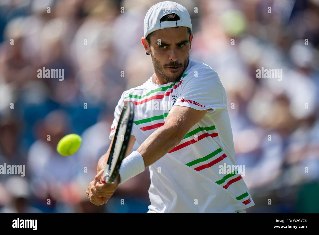 Thomas Fabbiano of Italy playing backhand against Sam Querrey of USA at Nature Valley International 2019, Devonshire Park, Eastbourne - England. Frida Stock Photo