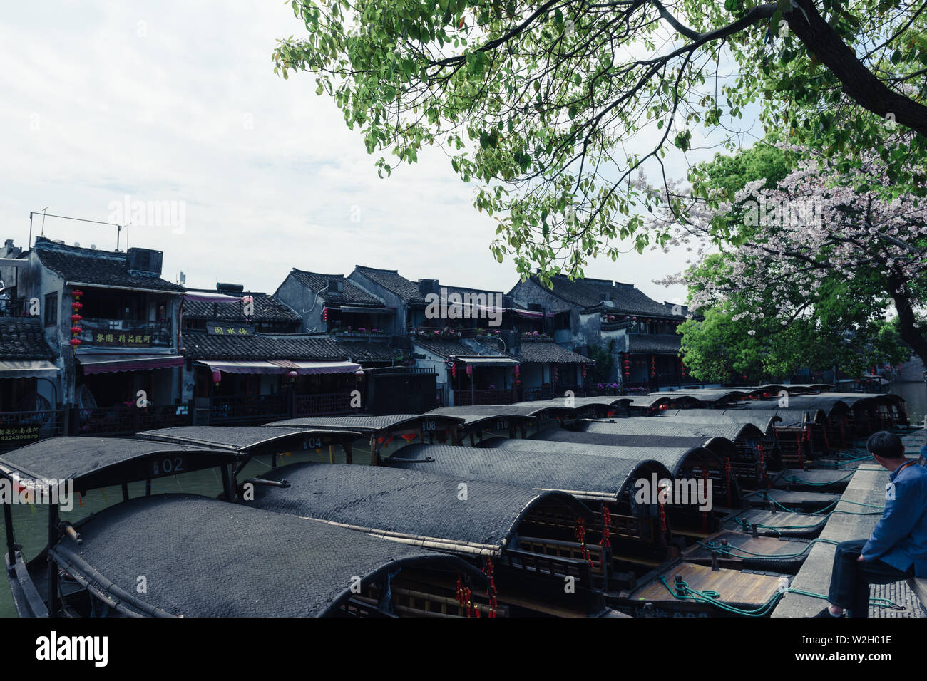 XITANG - Mar 31,2019: Tourist boats on the water canals of Xitang Town in Zhejiang Province, China Stock Photo