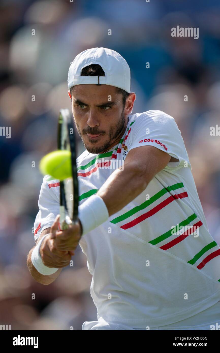 Thomas Fabbiano of Italy playing backhand against Sam Querrey of USA at Nature Valley International 2019, Devonshire Park, Eastbourne - England. Frida Stock Photo