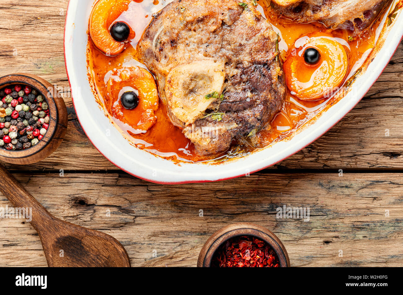Ossobuco, traditional dish of Italian cuisine. Stewed veal leg Stock