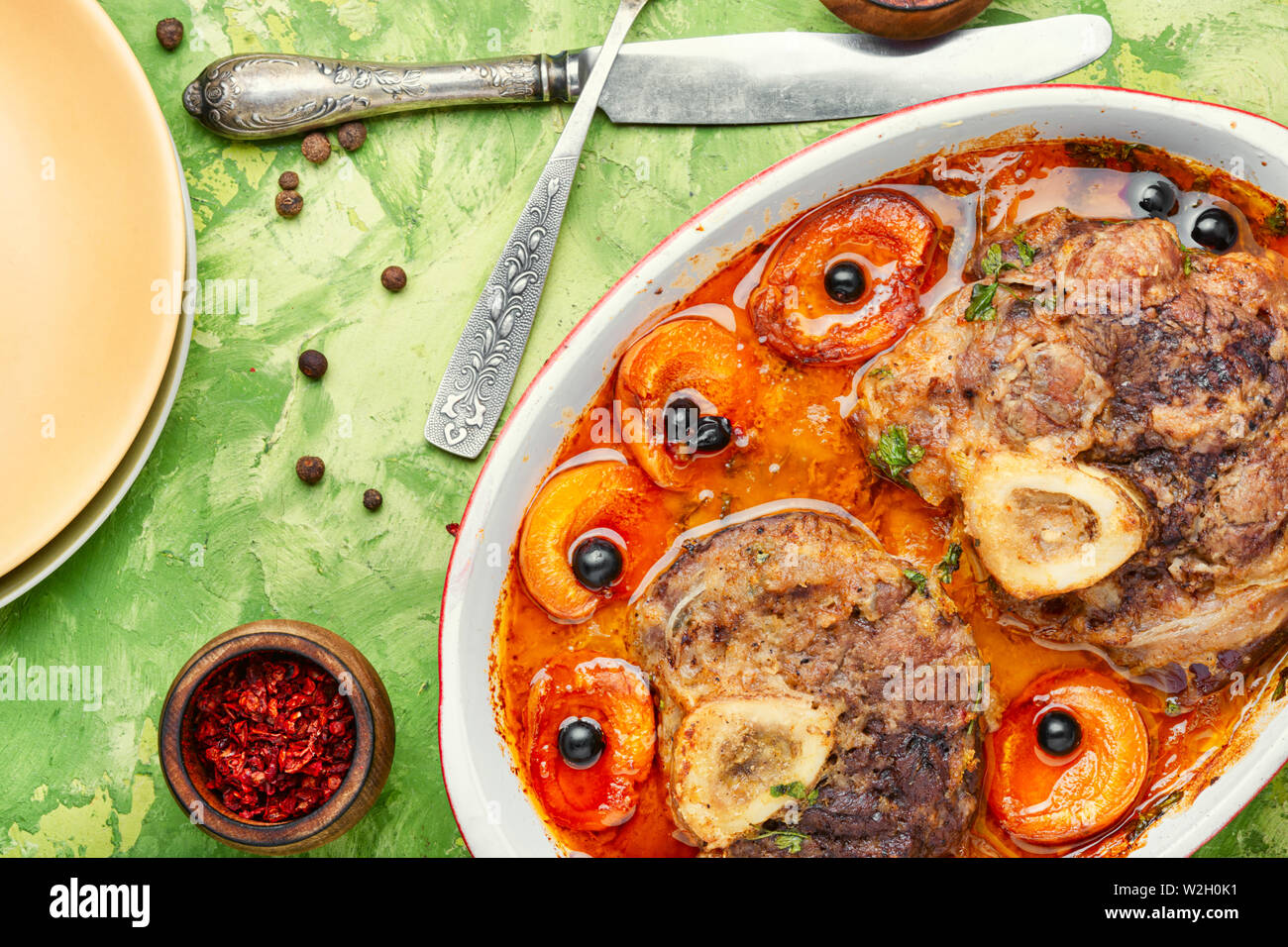 Ossobuco, traditional dish of Italian cuisine. Stewed veal leg Stock