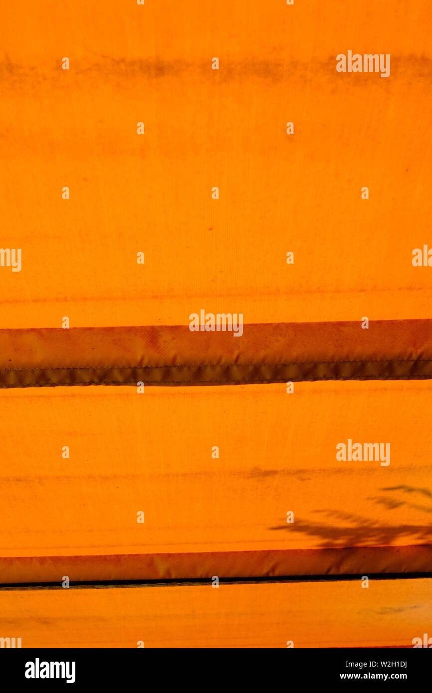 internal view of a bus roof in Corfu town. the light was coming in through the roof a lovely orange colour Stock Photo