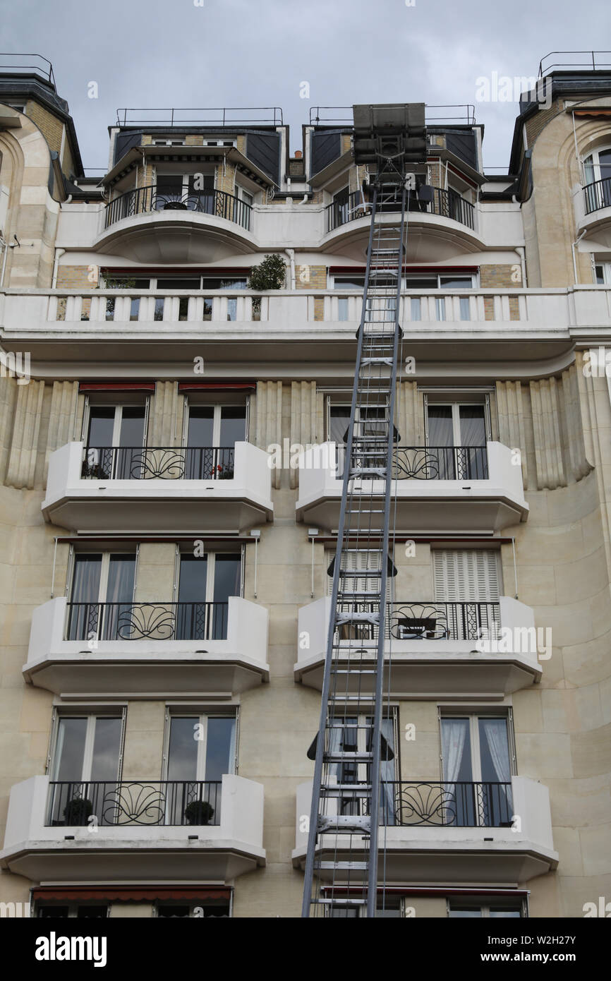 Building in Neuilly sur Seine, France. Removal ladder. Stock Photo