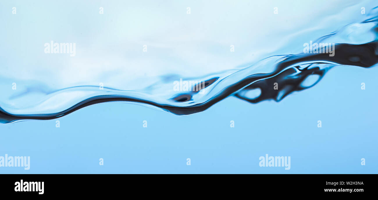 Water splash, clear blue water with waves Stock Photo