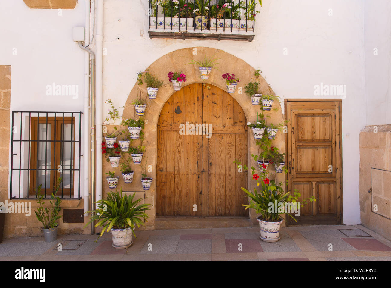 Xabia Spain Front Door With Plants Pots And Flowers Church In The Historic Spanish Town Stock Photo Alamy
