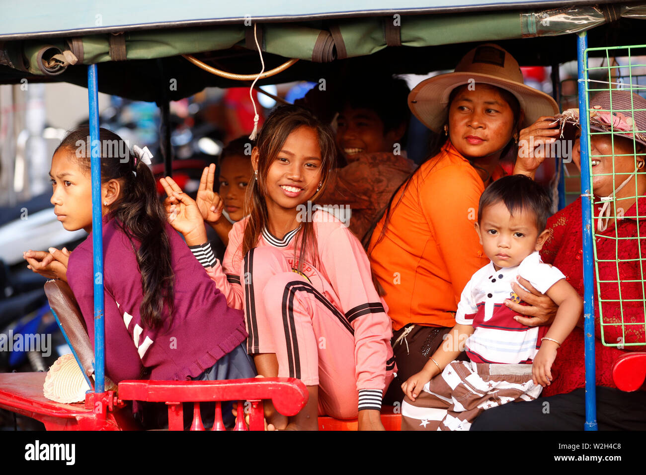 Cambodian family in a Tuk Tuk.  Phnom Penh. Cambodia. Stock Photo