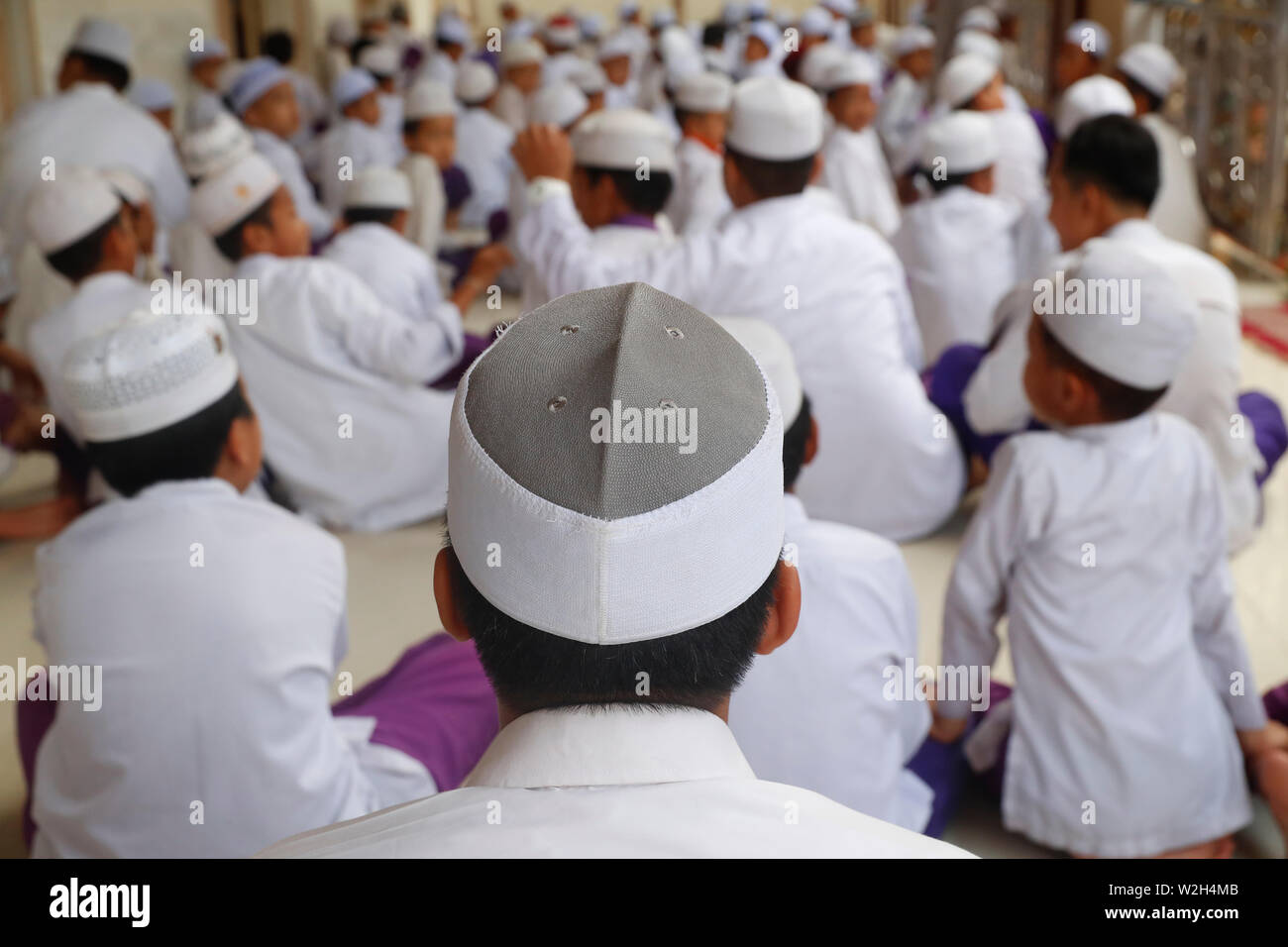 Nurunnaim mosque.  Young muslim boys praying for friday prayer. Phnom Penh. Cambodia. Stock Photo