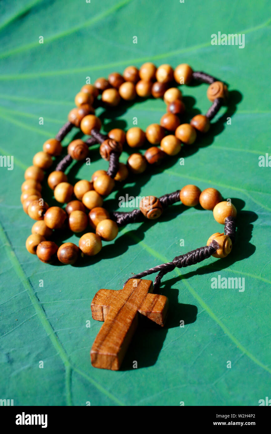 Catholic prayer beads on a lotus leave Stock Photo Alamy
