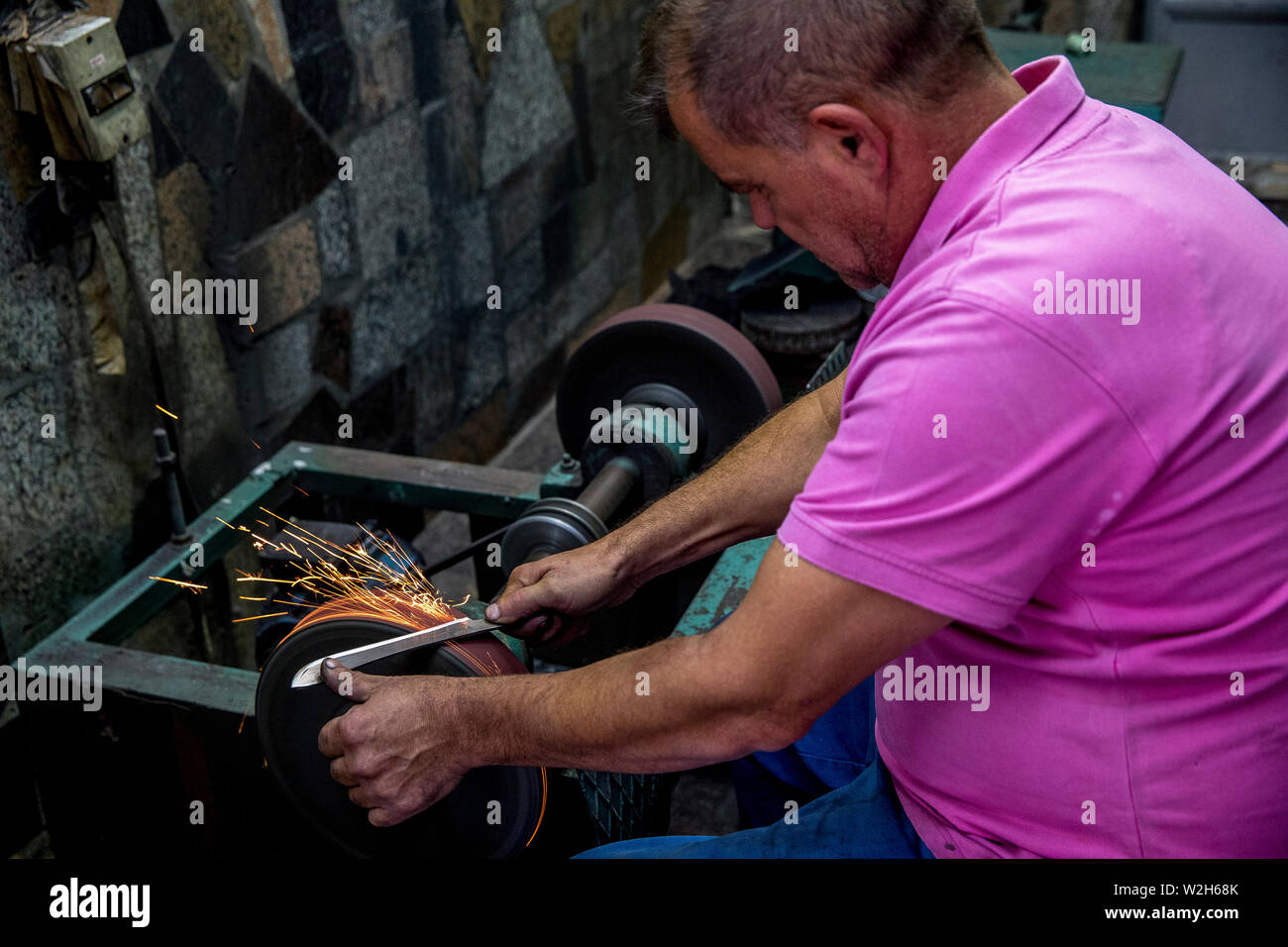 Knife maker XHEMAJILI HOTI, at work in Prizren, Kosovo, received loans from AFK microfinance. Stock Photo