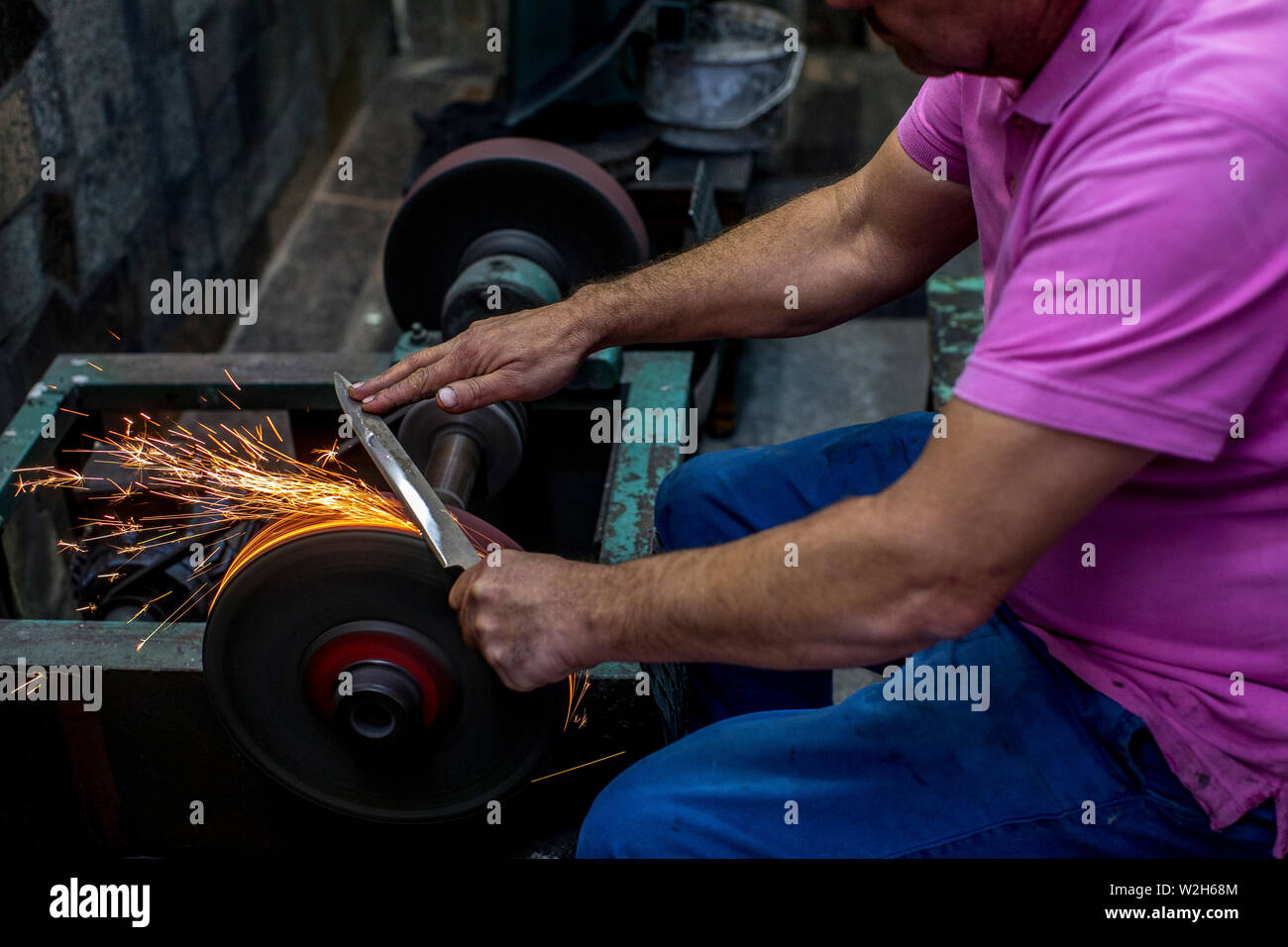 Knife maker XHEMAJILI HOTI, at work in Prizren, Kosovo, received loans from AFK microfinance. Stock Photo