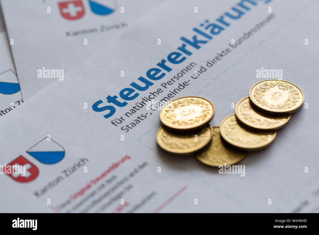 several golden coins on Swiss tax declaration form, Canton of Zurich