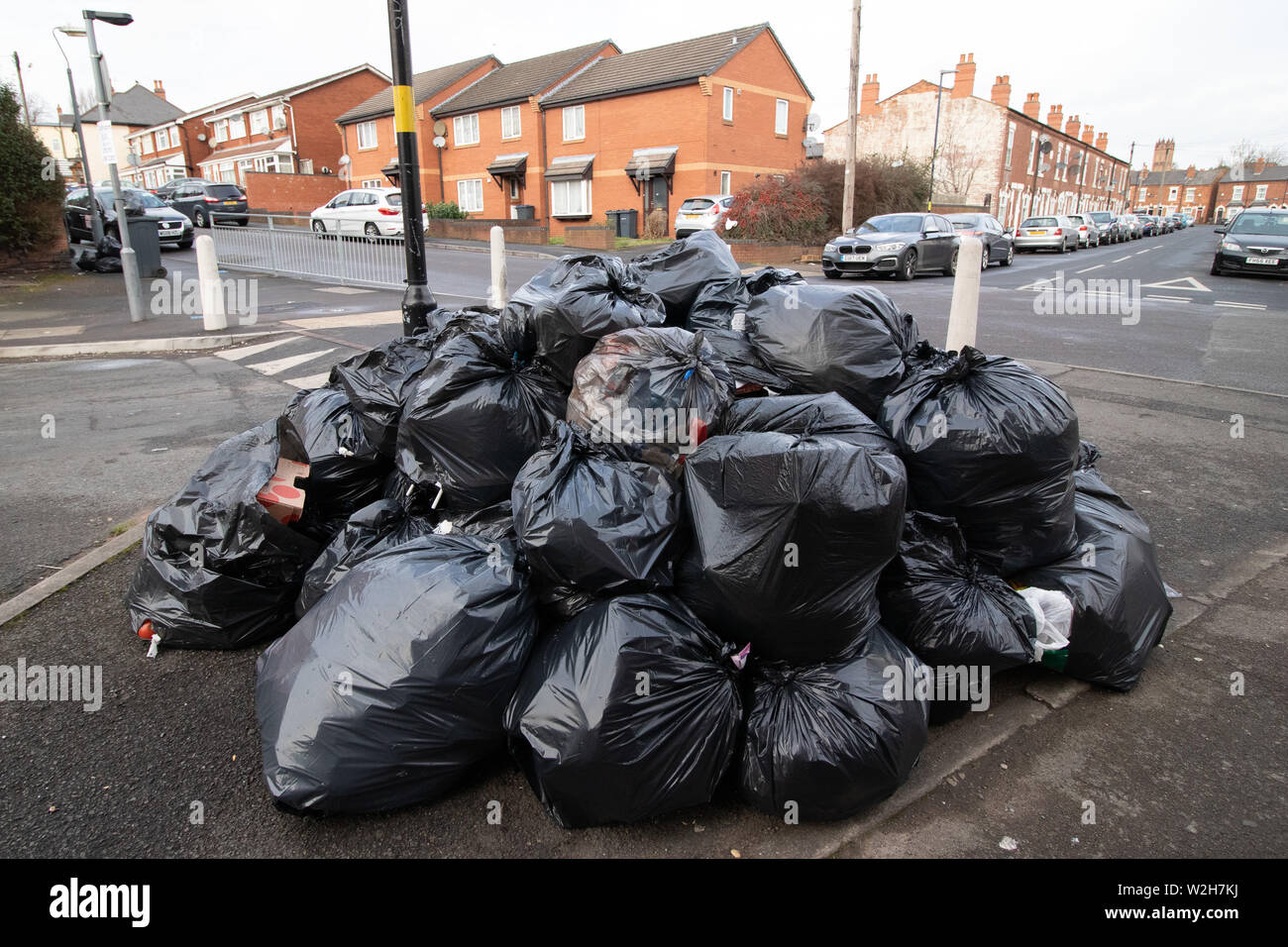 Streets of Birmingham showing uncollected sacks of waste material due