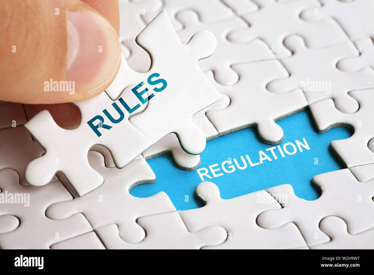 White puzzle with word RULES and REGULATIONS Stock Photo Alamy